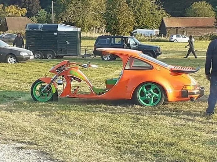This Thing Is A Bright Orange Porsche Turned Bike. Deathtrap On Wheels