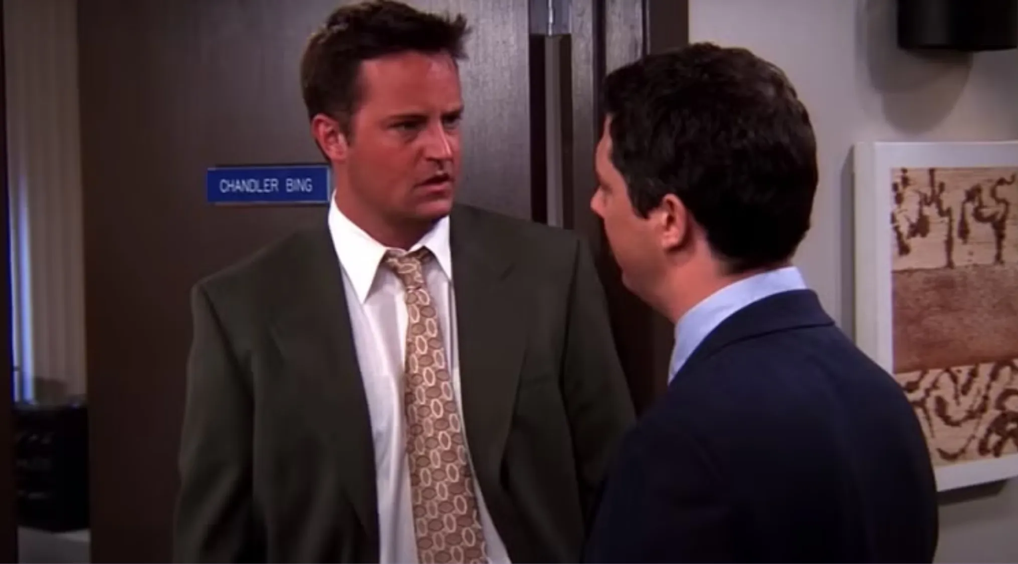 Chandler’s coworker mistakenly calls him by the wrong name in an office scene from Friends TV show.