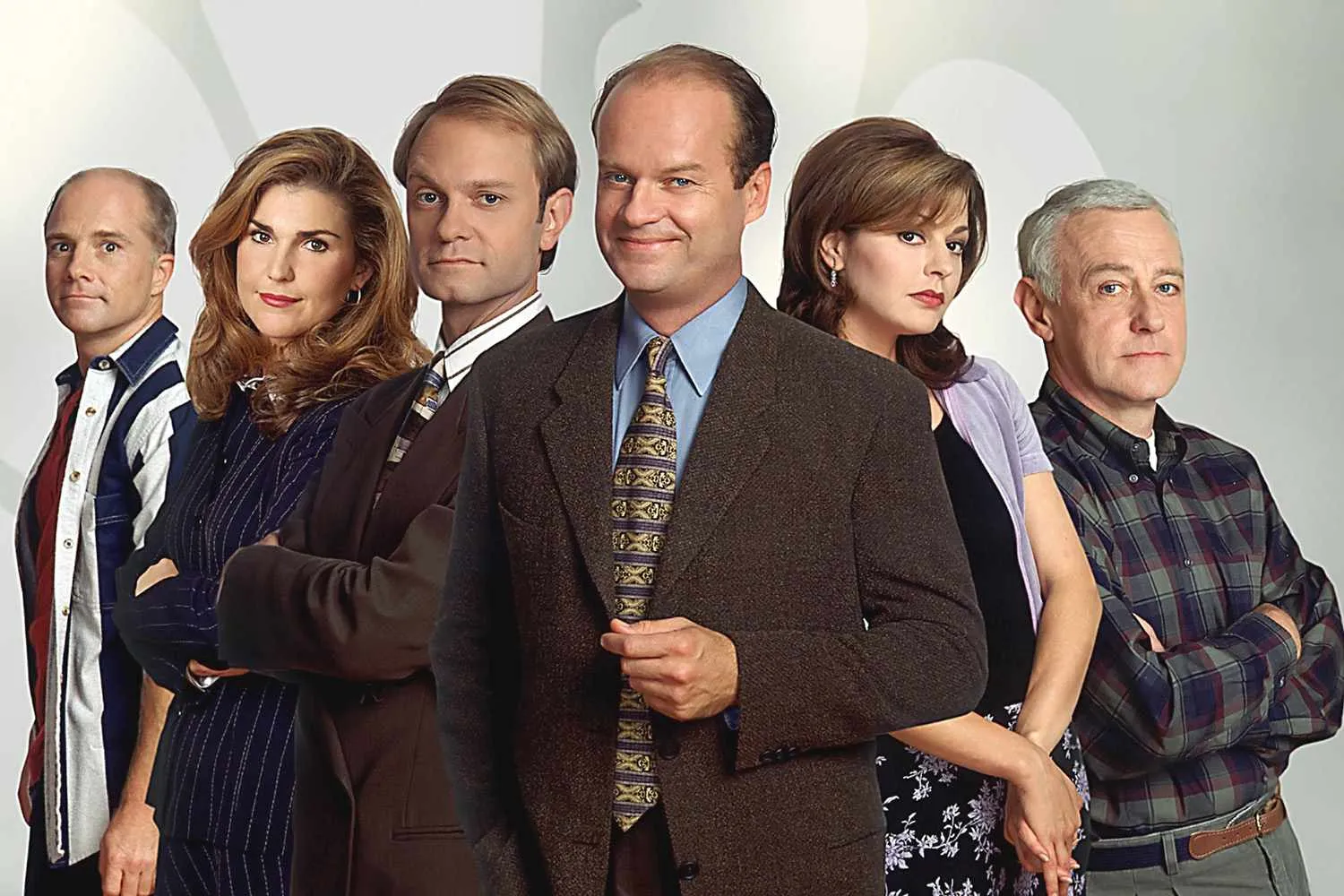 Cast of the popular TV show Frasier standing together dressed in 90s style clothing promoting comfort TV rerun.