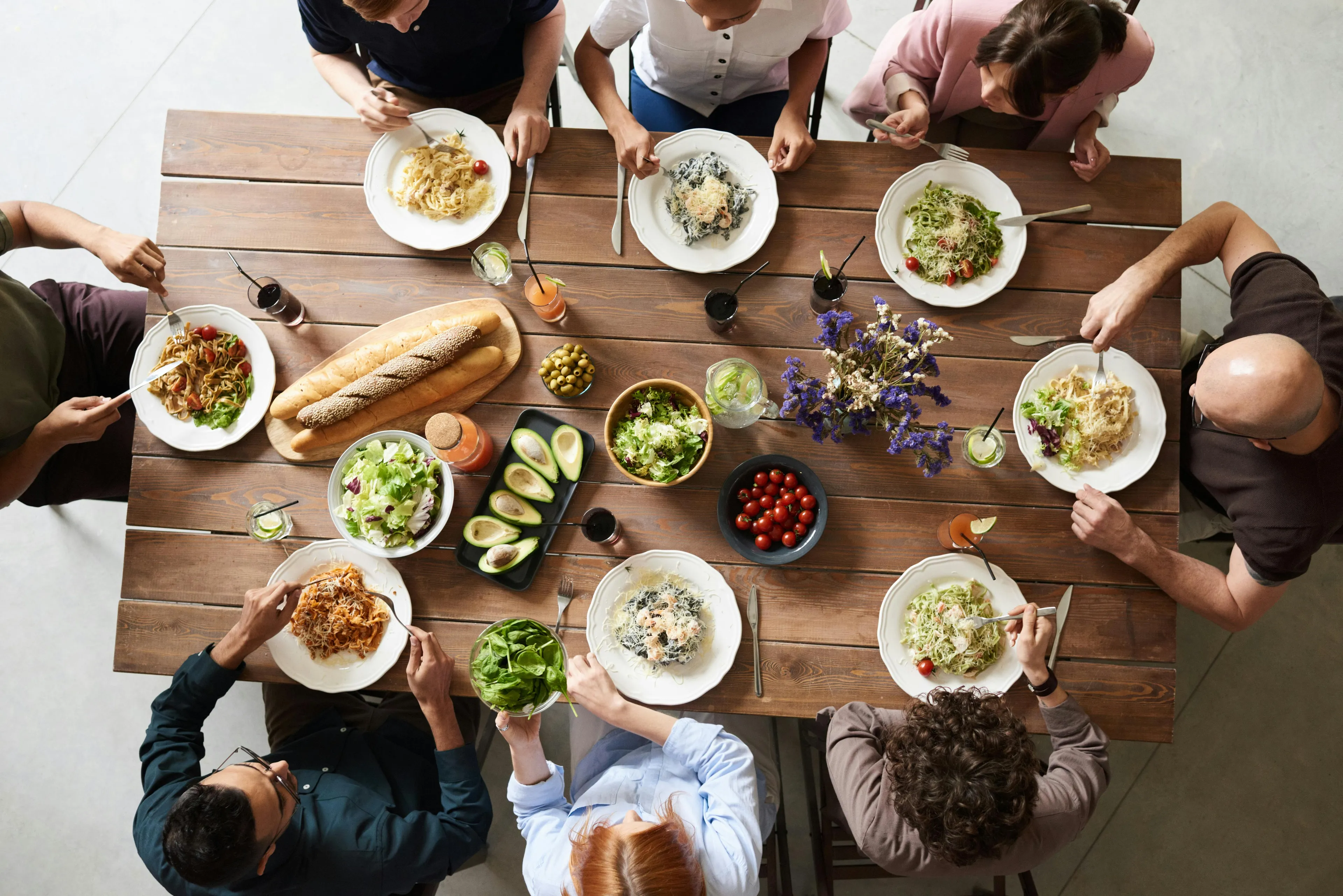 Family enjoying diverse dinner dishes together at a wooden table in a boundary style personality quiz setting.