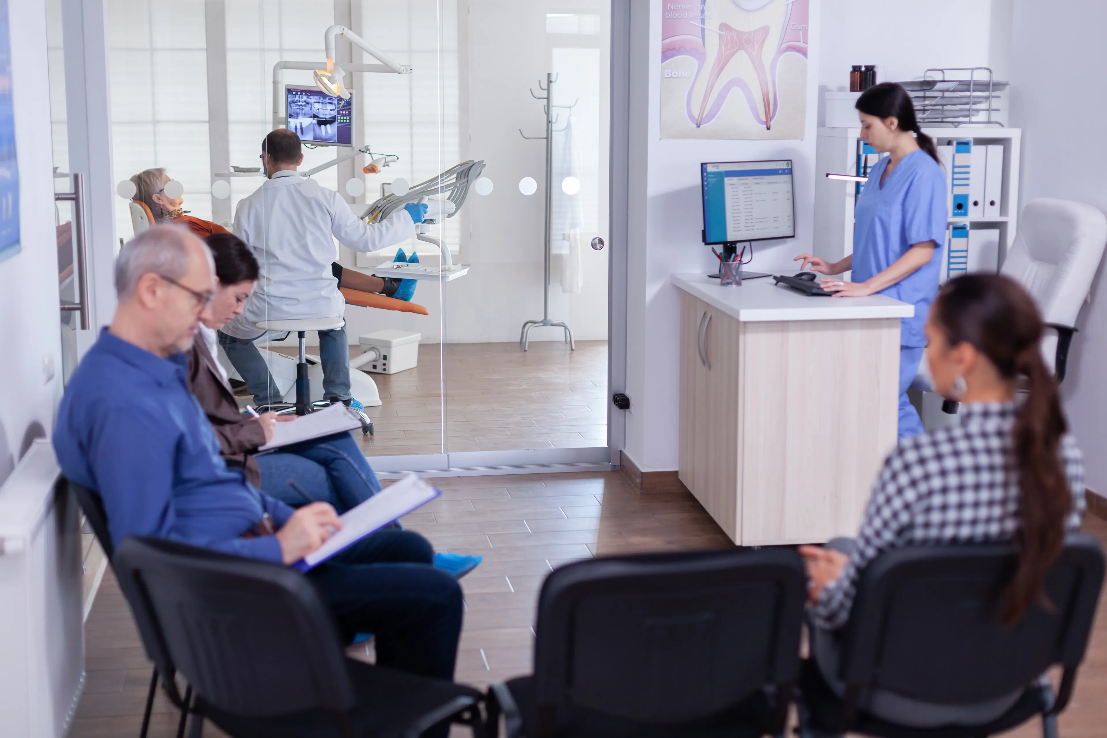 Patients waiting in a dental office with a receptionist working, illustrating boundary style personality quiz scenario.
