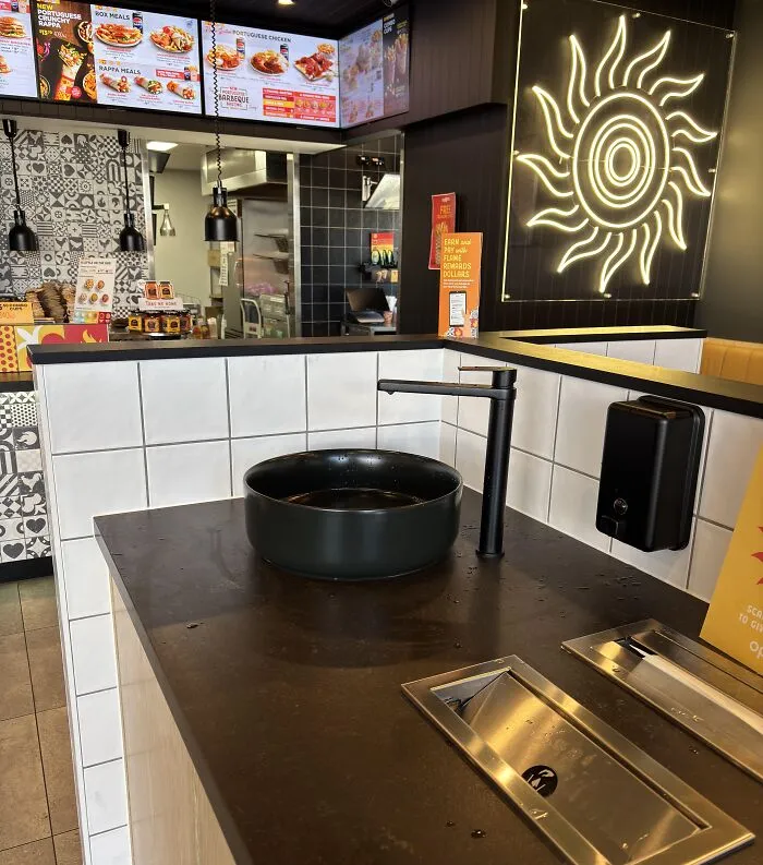 There’s A Sink In The Middle Of This Fast-Food Restaurant Lobby For Customers To Wash Their Hands