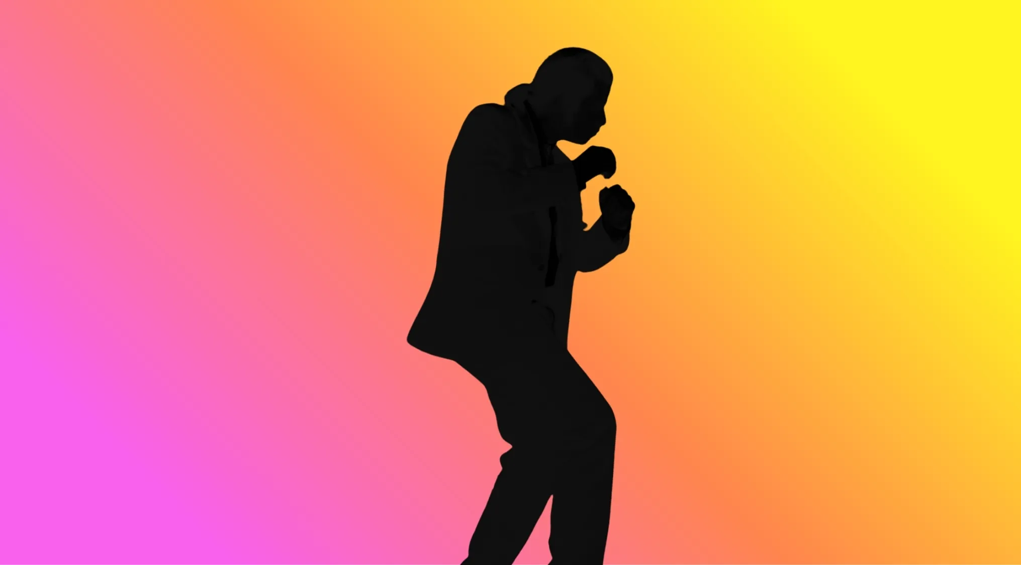 Silhouette of a movie character in a dynamic pose against a gradient background for guessing the movie character.