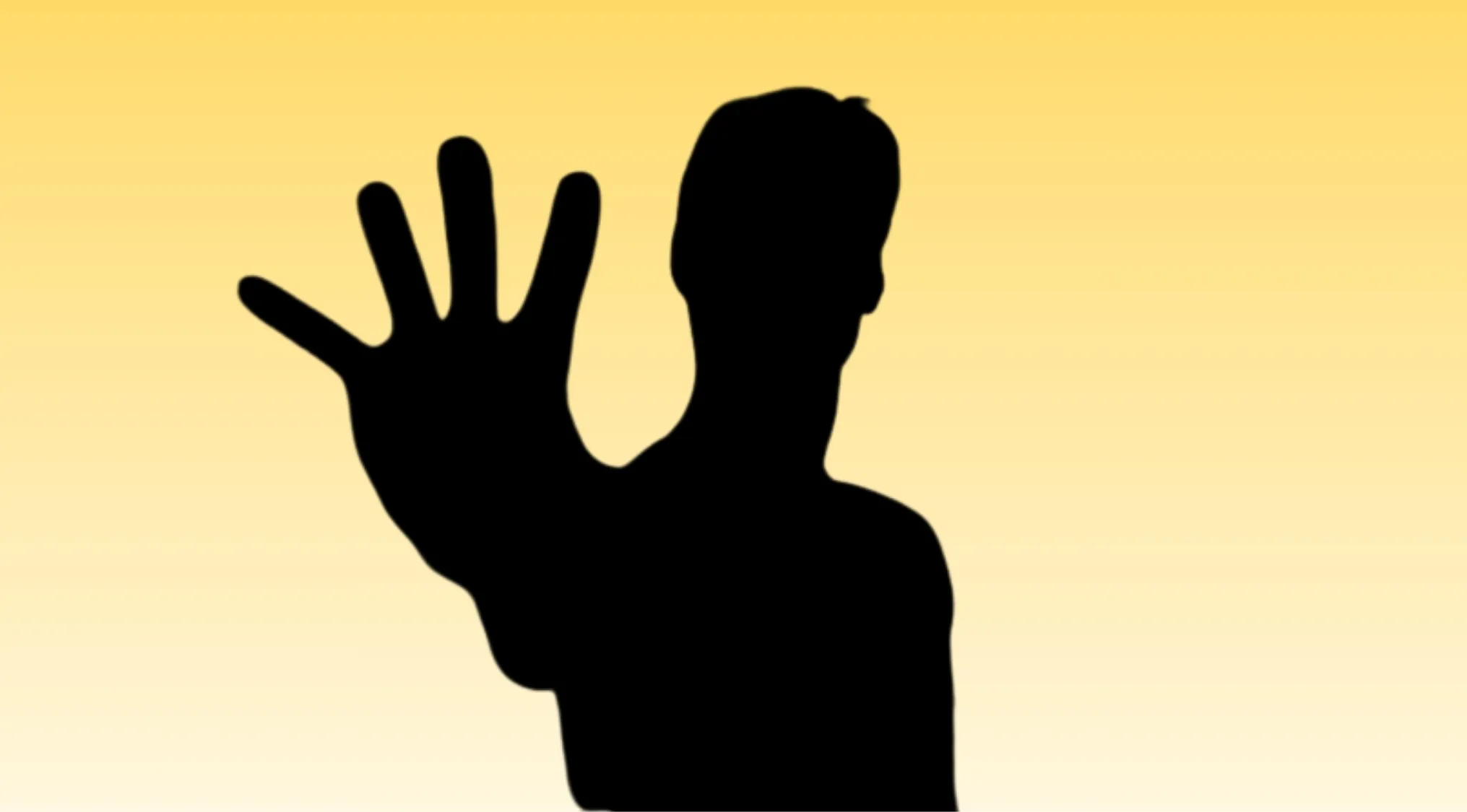 Silhouette of a Matrix character with an outstretched hand against a gradient yellow background.