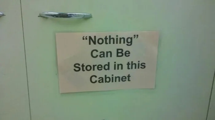 Sign with suspicious quotation marks around the word nothing, making the storage rule sound hilariously doubtful on cabinet door.