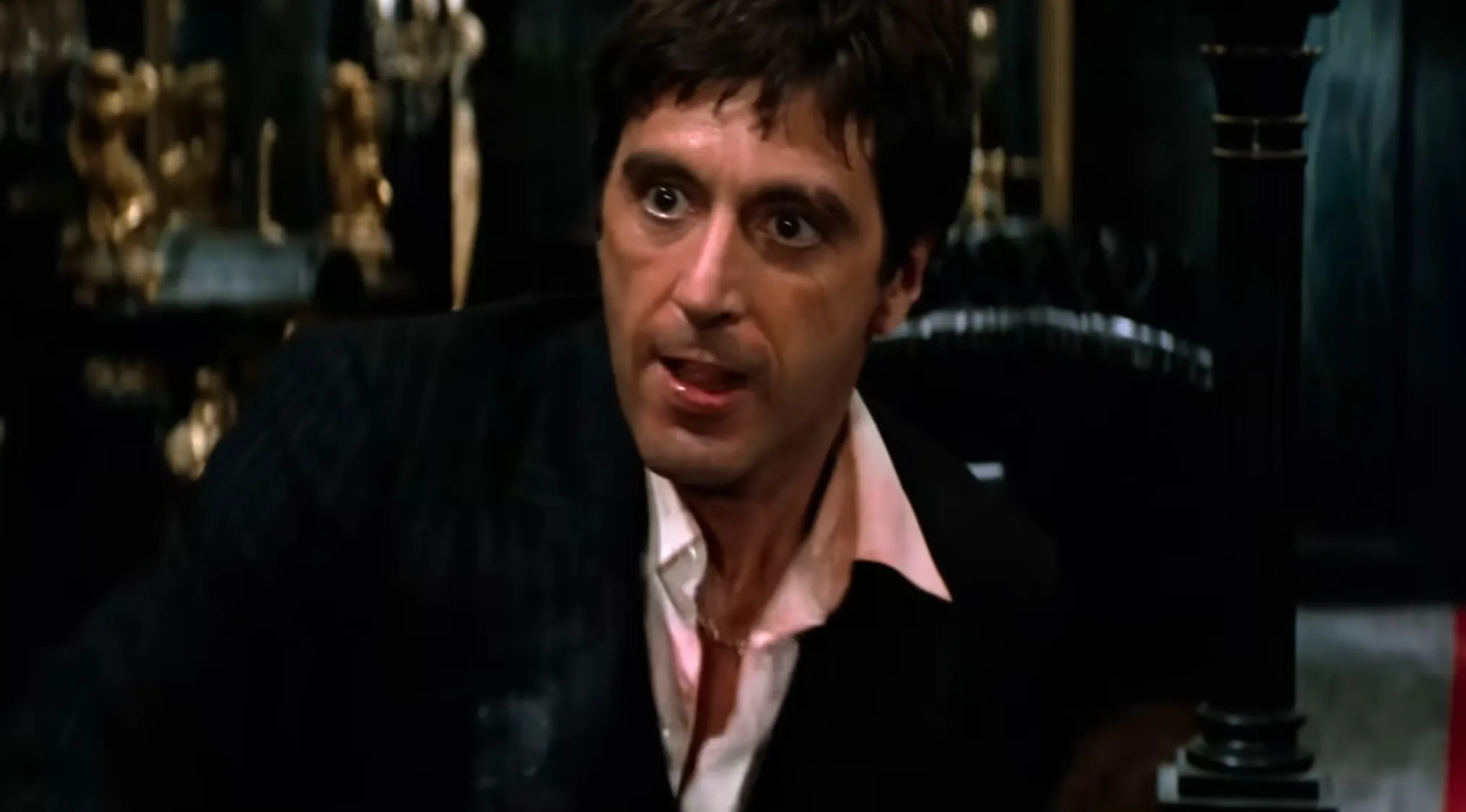 Tony Montana in Scarface intense scene, focusing on famous last words in the movie's climax moment.