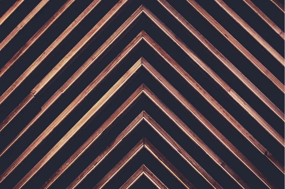 Art Deco geometric panels with alternating wood tones forming a 1980s home design trend pattern.