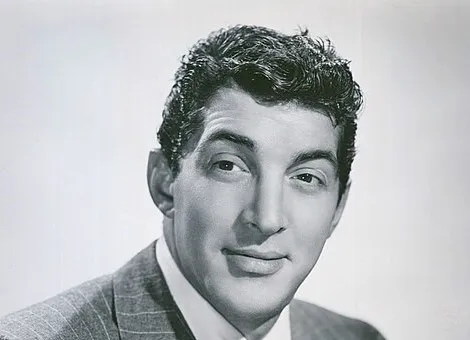 Portrait of iconic crooner Dean Martin in a suit, known for releasing In the Wee Small Hours in 1955.