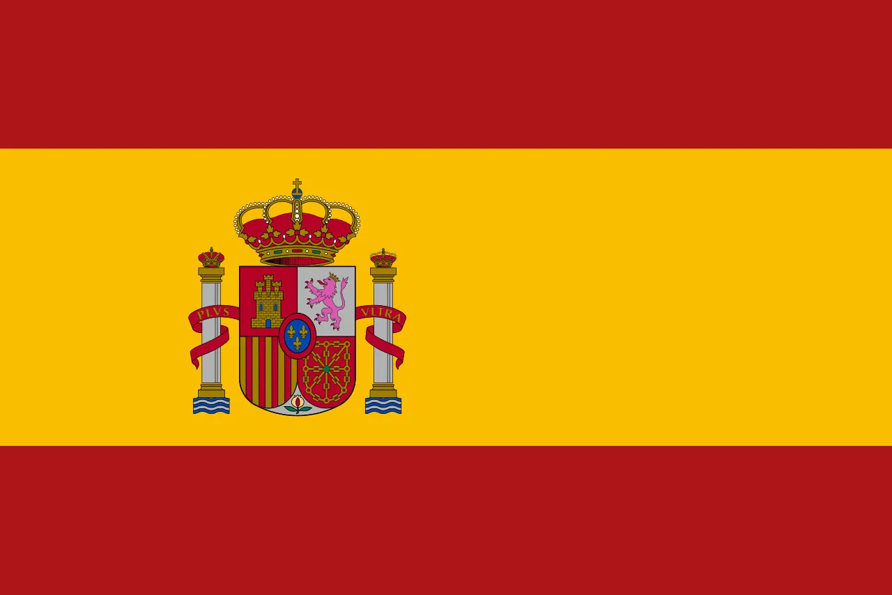 Spanish flag with red and yellow stripes and detailed coat of arms symbolizing Spain as a travel destination