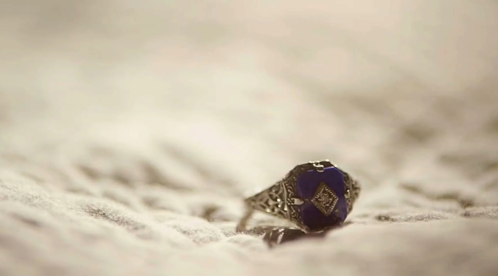Close-up of a detailed amulet ring from a TV show prop used to surpass a certain weakness in the storyline