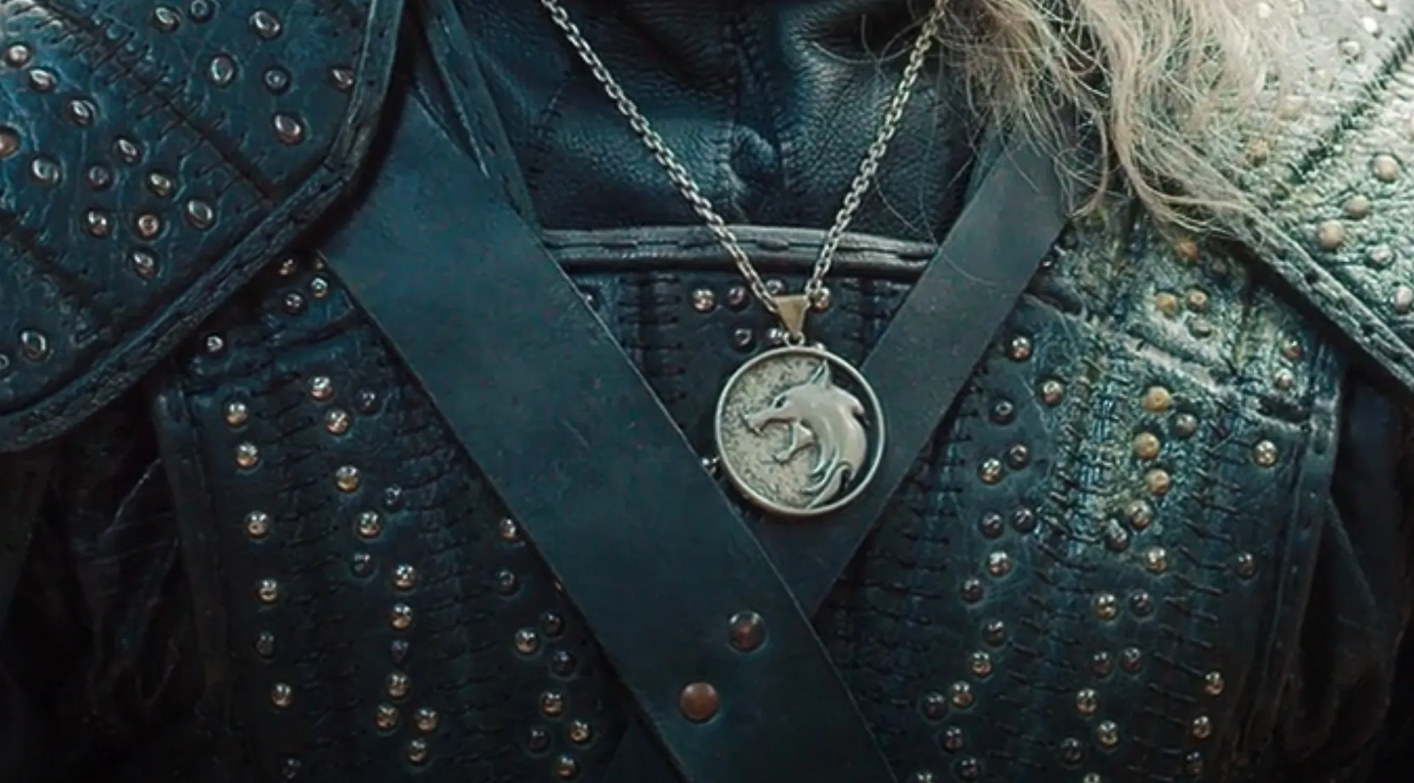Medallion pendant featuring a wolf symbol worn with studded armor in a popular TV show prop quiz.