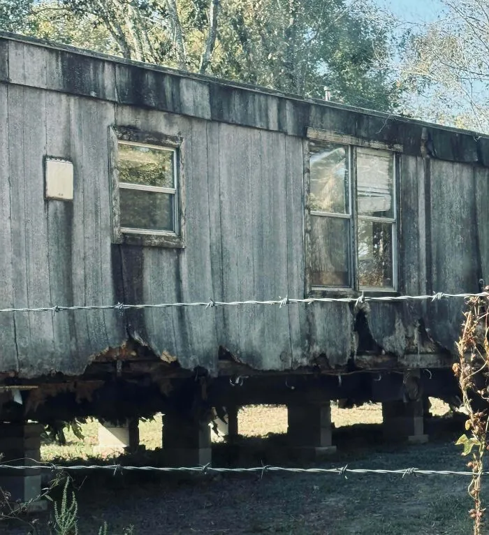 Neighbor Moved A Rotting Mobile Home Next To Our Property Fence