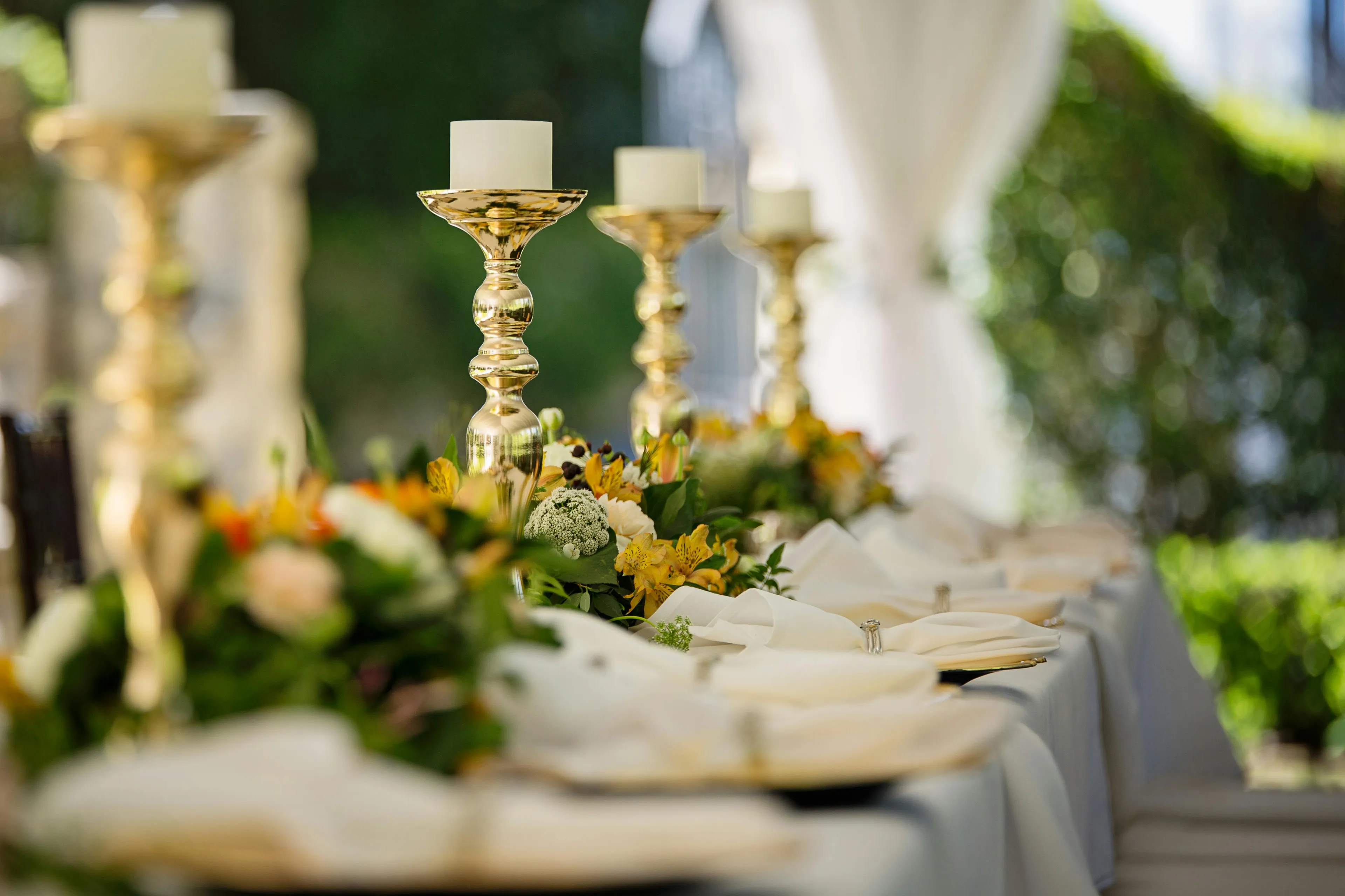 Elegant wedding table setup with candles and floral arrangements, illustrating decision making style decoder in dining choices.