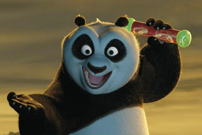 Animated character Po from Kung Fu Panda holding a scroll with an excited expression at sunset.