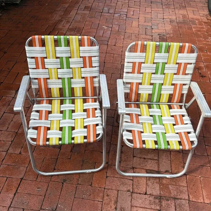 Two vintage folding chairs with colorful woven seats, a perfect jackpot find at a thrift store.