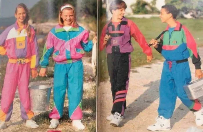 Kids wearing colorful 90s-style tracksuits, enjoying outdoor fun, capturing nostalgic 90s memories and fashion trends.