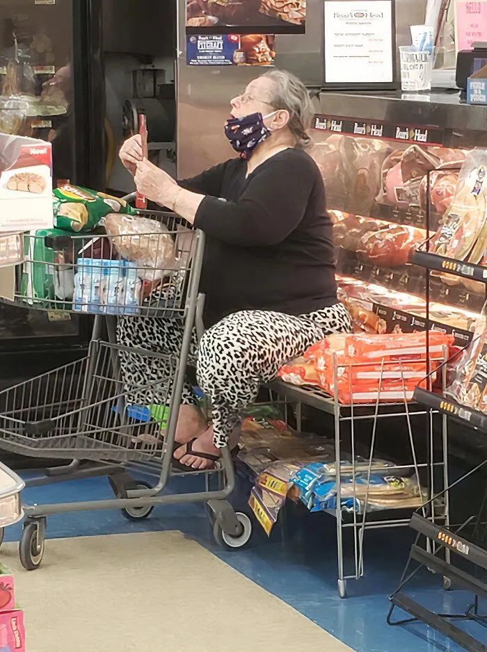 Here's Some Lady At A Grocery Store Sitting On Some Bread