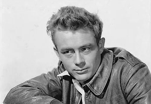 Black and white portrait of James Dean wearing a leather jacket, representing 50s general knowledge questions on cultural icons.