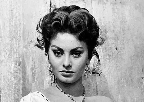 Close-up of actress Sophia Loren with styled hair and elegant earrings, embodying a classic 1950s style icon look.