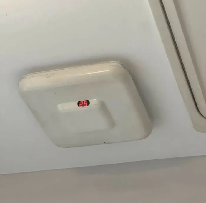 Ceiling-mounted unidentified object with digital display showing number 25, example of the internet solving mystery objects.