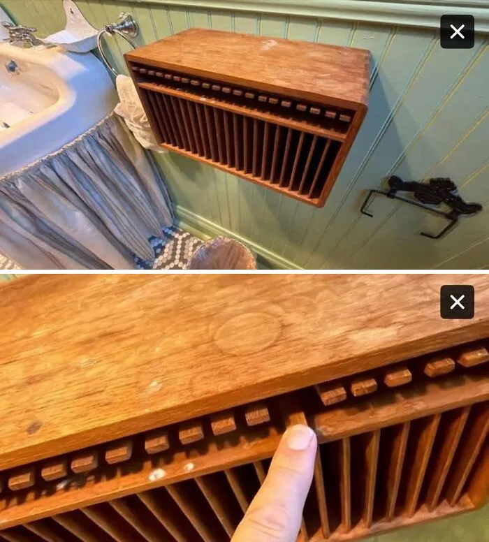 Wooden wall-mounted organizer identified by the internet as a vintage soap saver or soap drying rack.