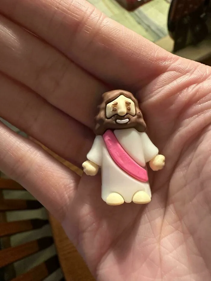 I Think Someone Put This Tiny Pink-Sashed Jesus In My Bag When I Wasn’t Looking