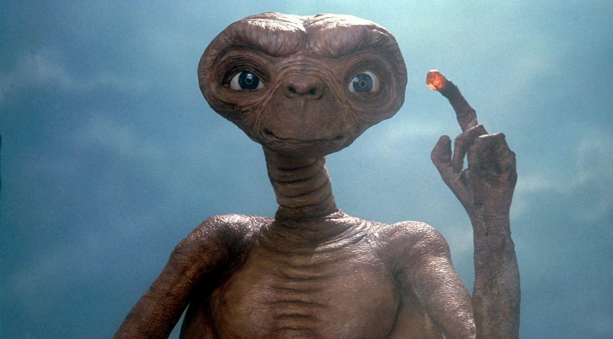 E.T. the Extra-Terrestrial character with glowing finger in a scene from the 1982 film directed by Steven Spielberg.