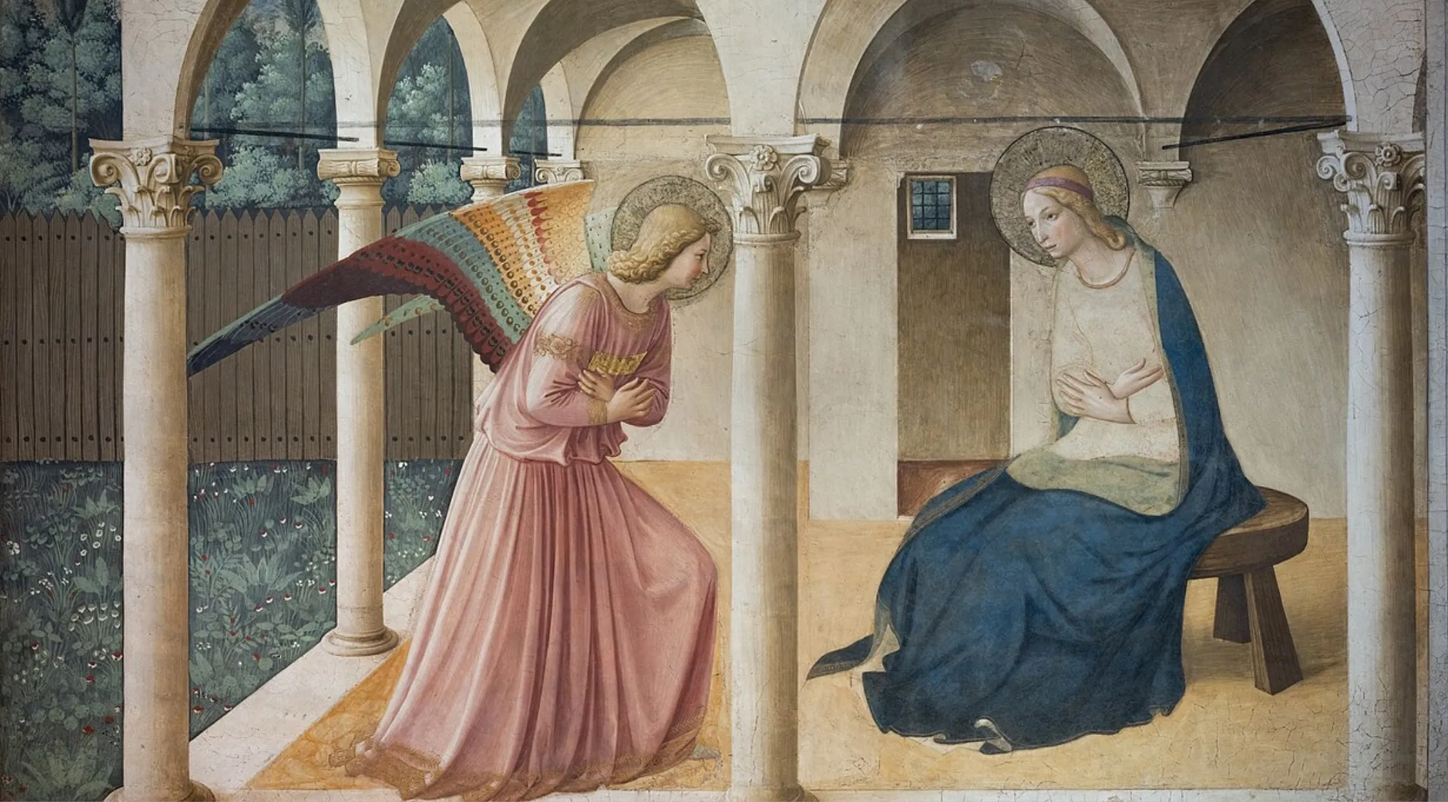 Fresco painting of an angel and a woman with halos under arches, showcasing art on wet plaster technique.
