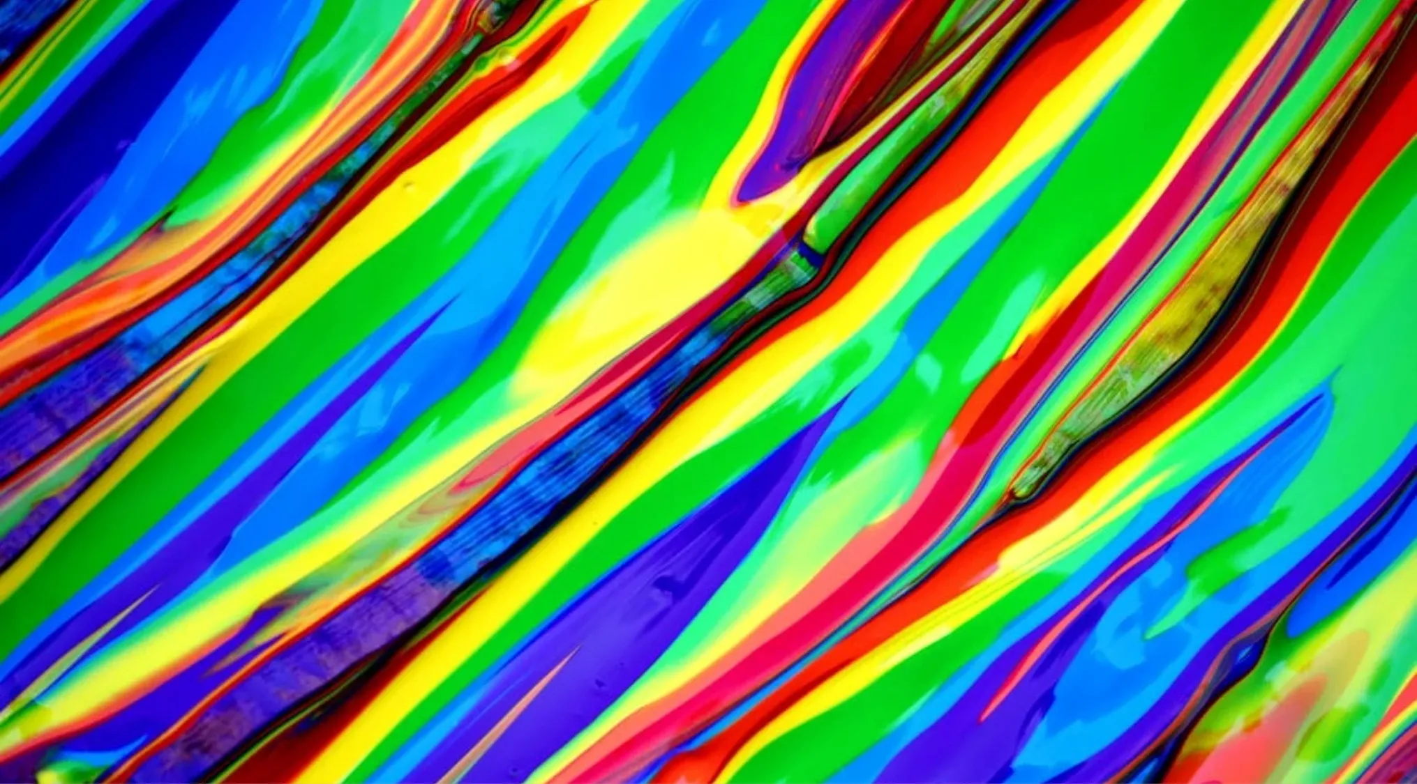 Bright abstract paint streaks illustrating general art knowledge and secondary colours in vibrant hues.