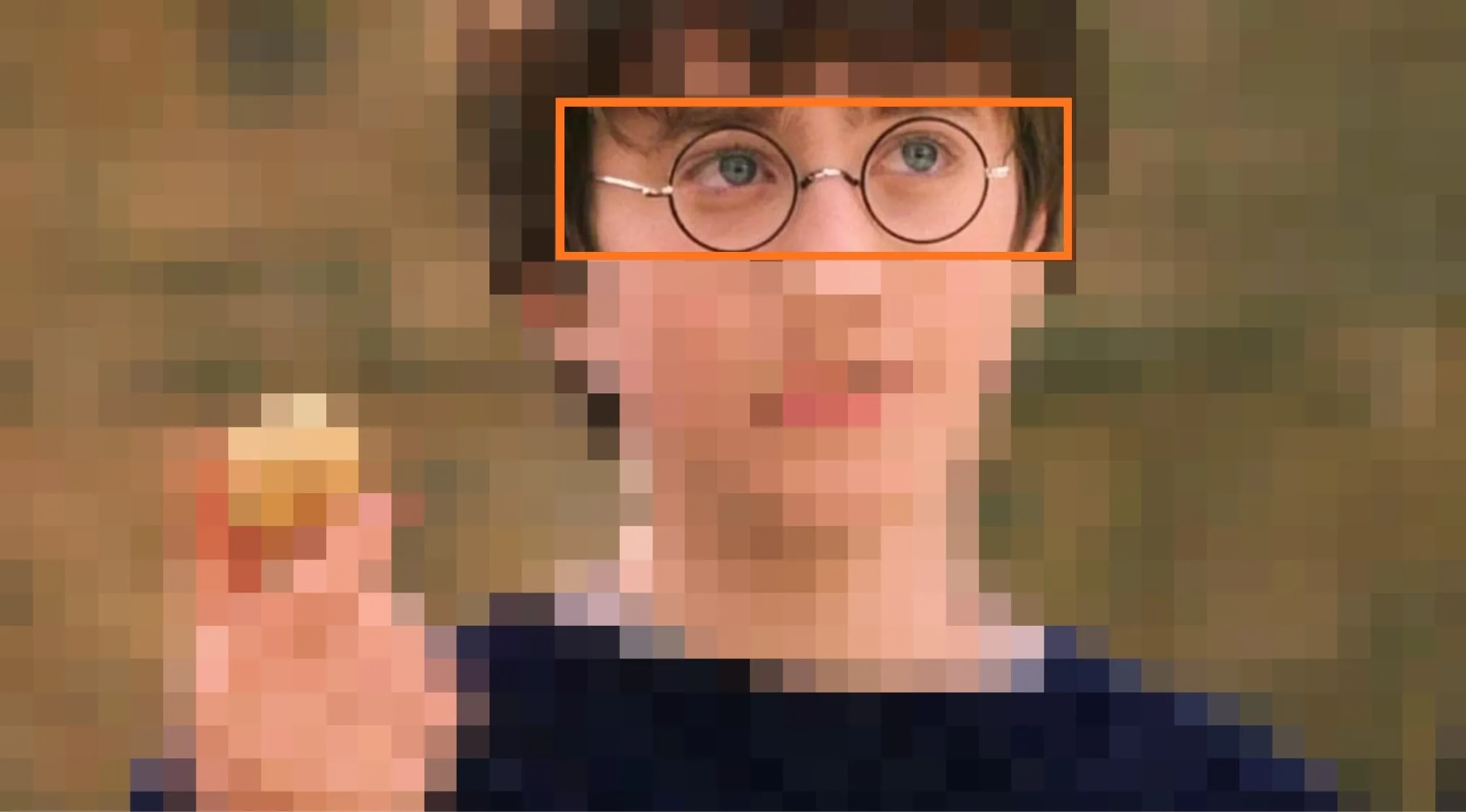 Close-up of a character’s eyes wearing round glasses, part of a magical saga in the guess the movie challenge.