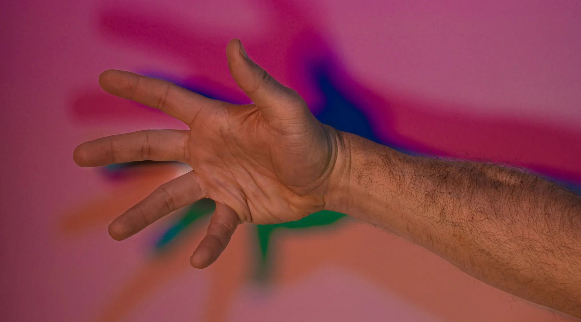 Close-up of a hand moving quickly through the air illustrating the force explaining sensation of resistance in science quiz.