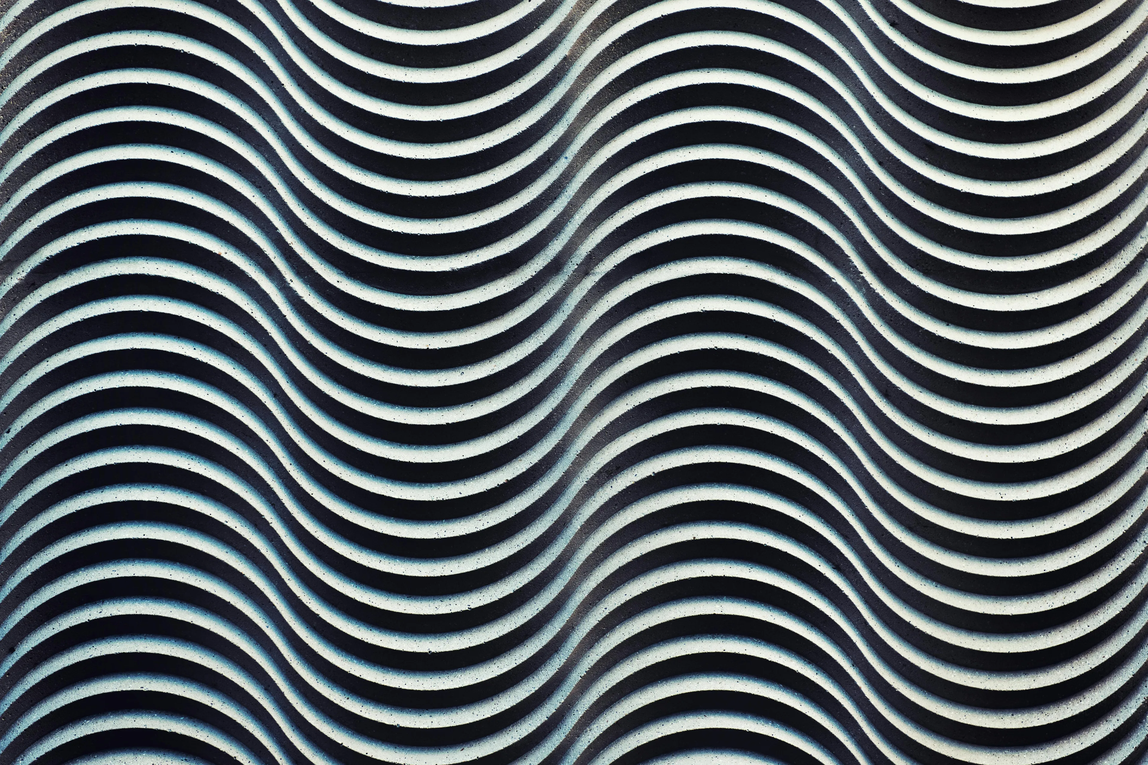 Abstract image of curved black and white lines illustrating wave patterns for general science knowledge quiz.
