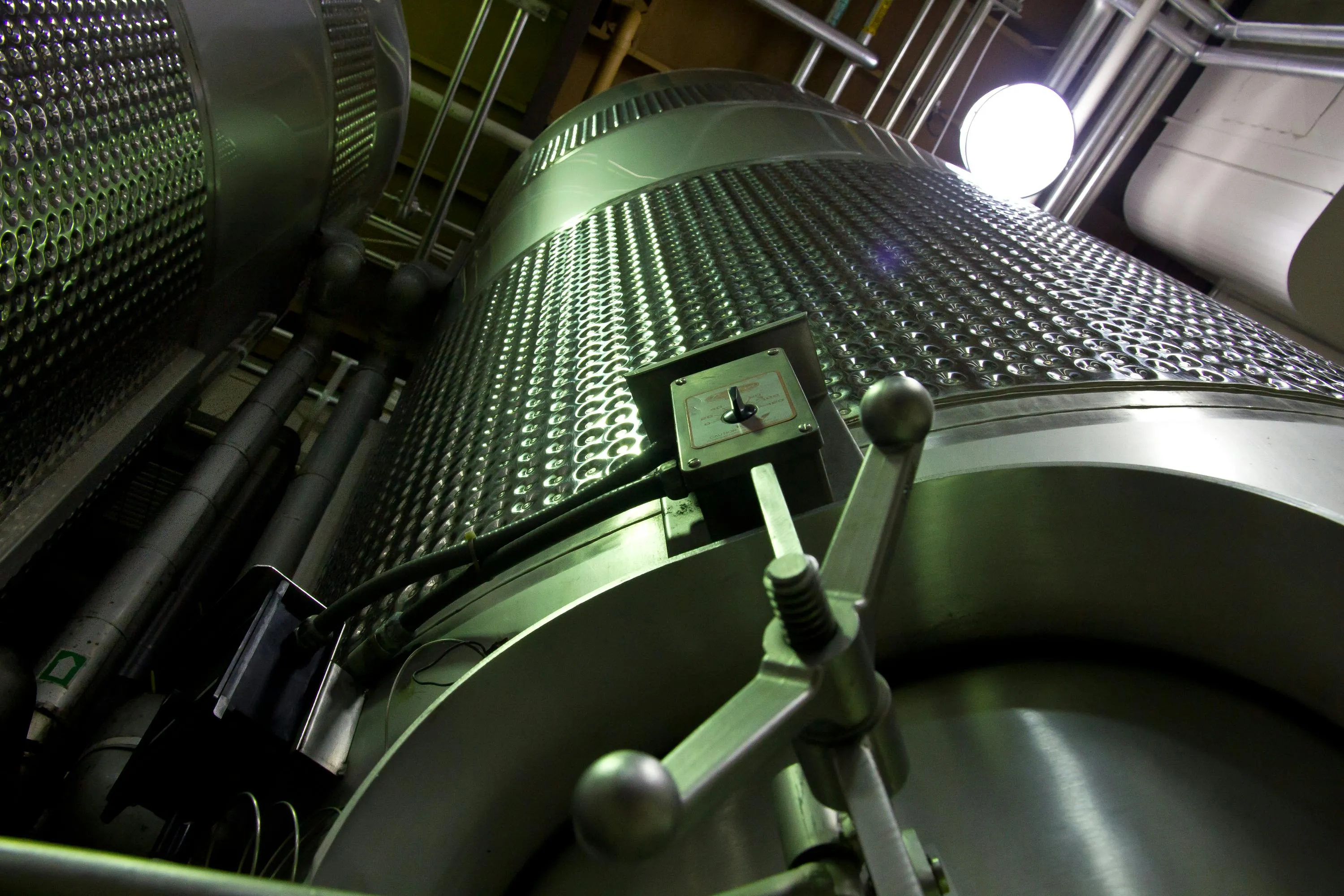 Large industrial reaction vessel with temperature control used in speeding up chemical reactions in science.