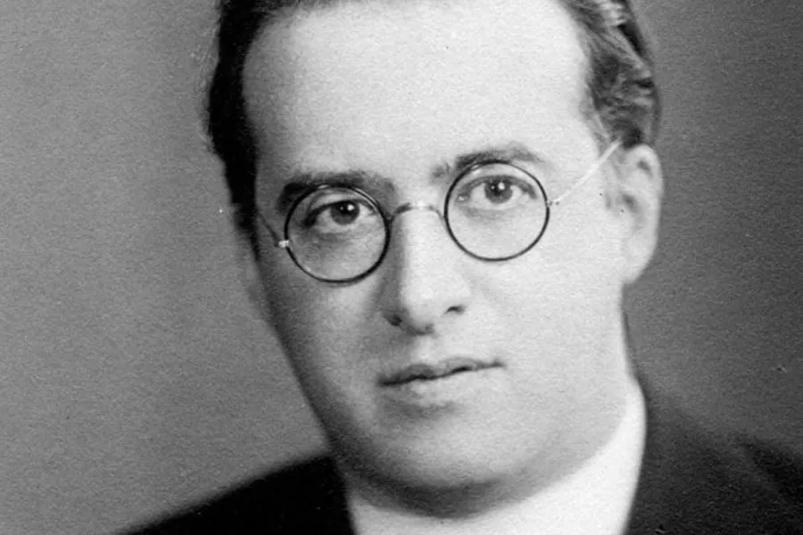 Black and white portrait of Georges Lemaître, historical figure credited with first proposing the Big Bang theory in 1927.