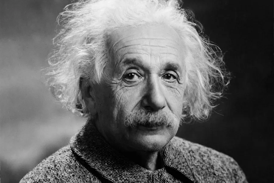 Albert Einstein portrait in black and white, known as the first historical figure linked to the Big Bang theory proposal.