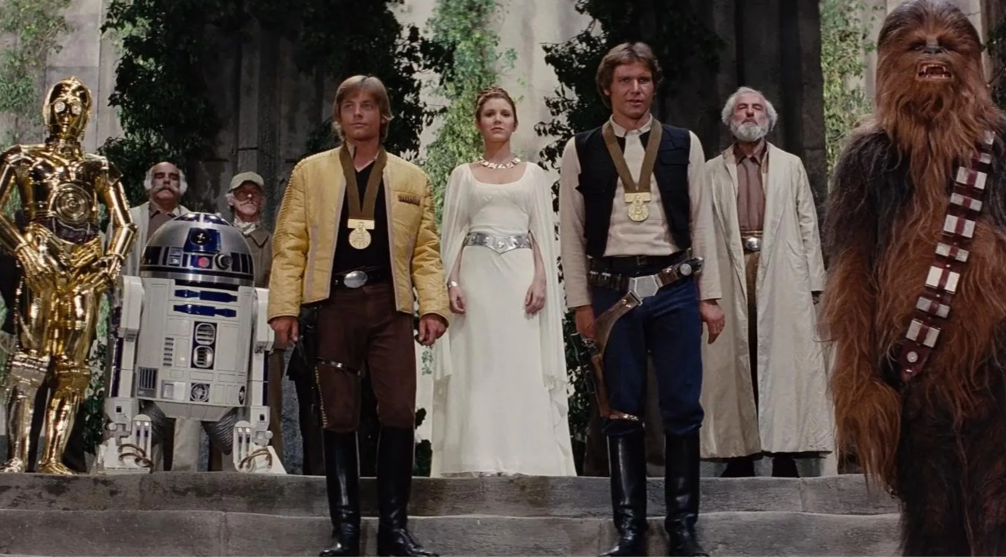 Main characters from the first Star Wars movie standing together in a forest setting, representing the 1970s decade.
