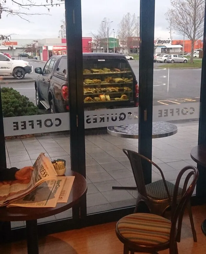 Mirage Of Coffee Shop Window Makes It Look Like This Car Sells Pies Out Of The Boot