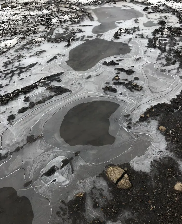 The Way This Picture Of A Frozen Puddle In My Backyard Looks Like A Landscape From The Perspective Of A Plane