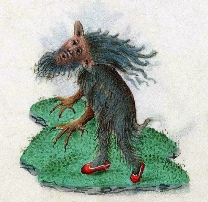 Bizarre medieval art creature with a human face, long claws, fur body, and red shoes standing on green grass.