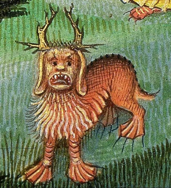 Medieval art depiction of a bizarre creature with antlers, a humanoid face, and a lion-like body on green grass.