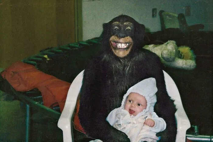 Travis, A Chimpanzee Who Eventually Went On To Horrifically Maul His Owner’s Friend, Holding A Baby