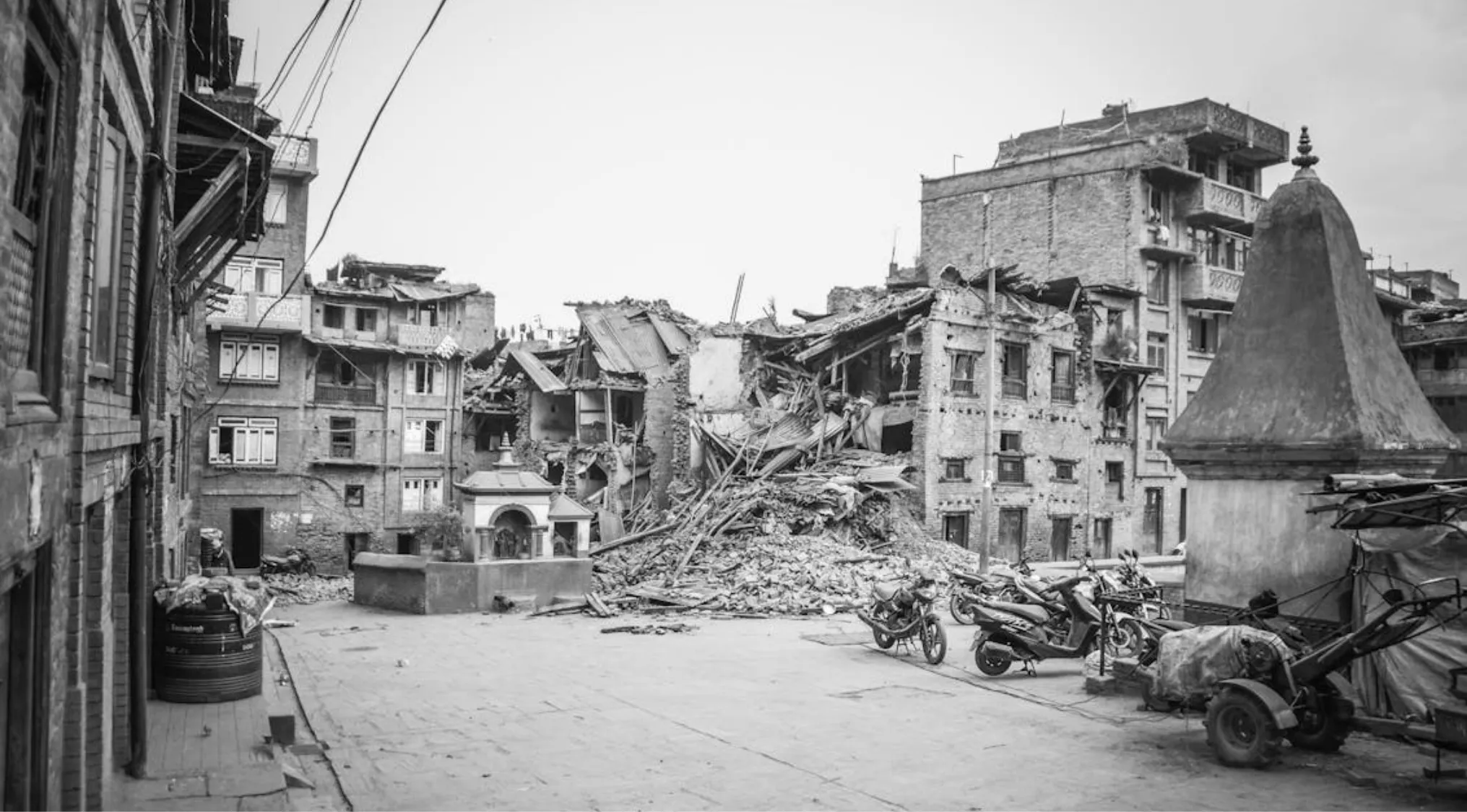 Collapsed buildings and debris in an urban area after an earthquake showing earthquake damage and destruction.