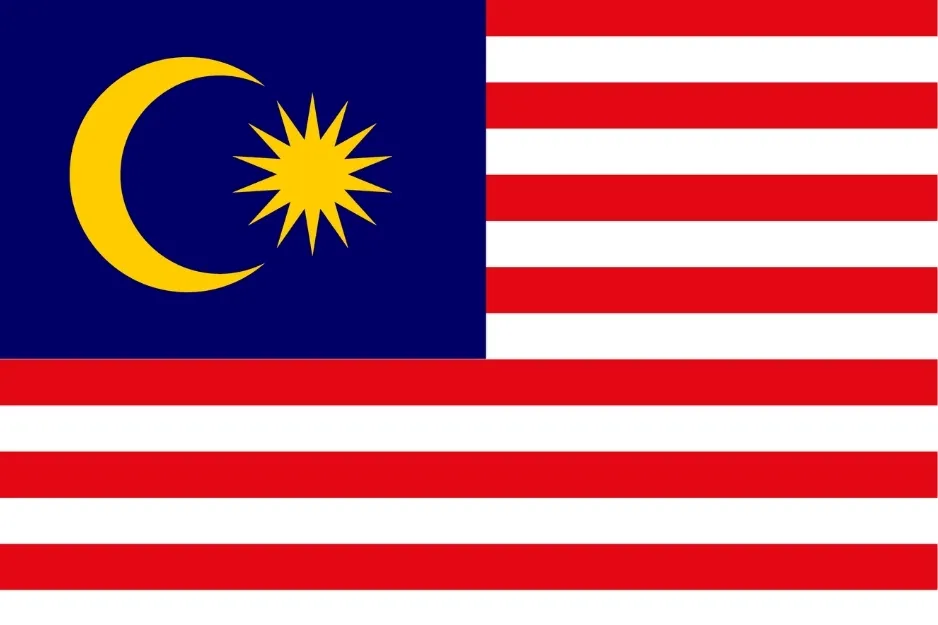Malaysian flag with crescent moon and star on blue field and red and white horizontal stripes representing Malaysia.
