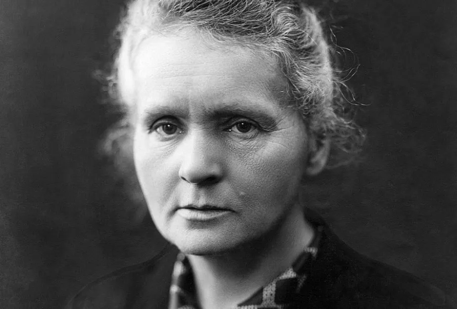 Black and white portrait of Marie Curie, the first woman to win a Nobel Prize, with a serious expression.