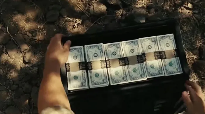 In No Country for Old Men, Llewelyn finds the grisly aftermath of a brutal fight. There’s a case full of money, and against his better judgment, he decides to take it with him, which kicks off a chain of bad luck in his life.
