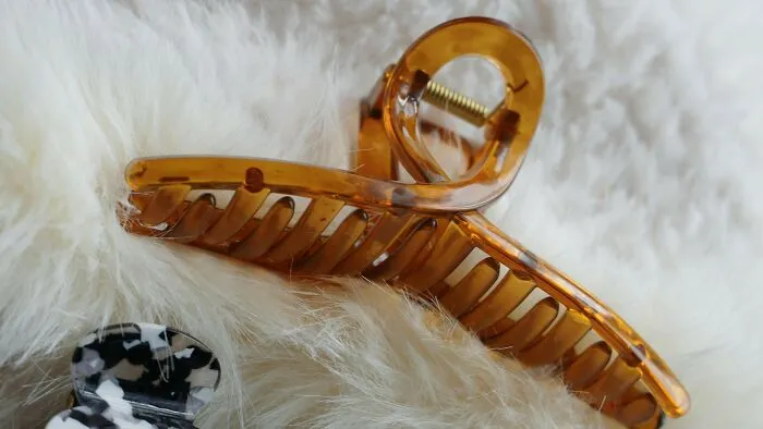 My mom used to have one of those claw clips for her hair, and I would clamp it on my mouth to see if it hurt. Obviously, it did! And I would do it again next time.