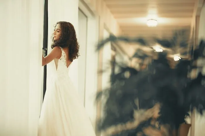You are a bridesmaid, and you accidentally spill coffee on the back of the dress 5 minutes before the ceremony, but she doesn’t notice, and you’re the only one behind her. Do you tell her or let her go out?