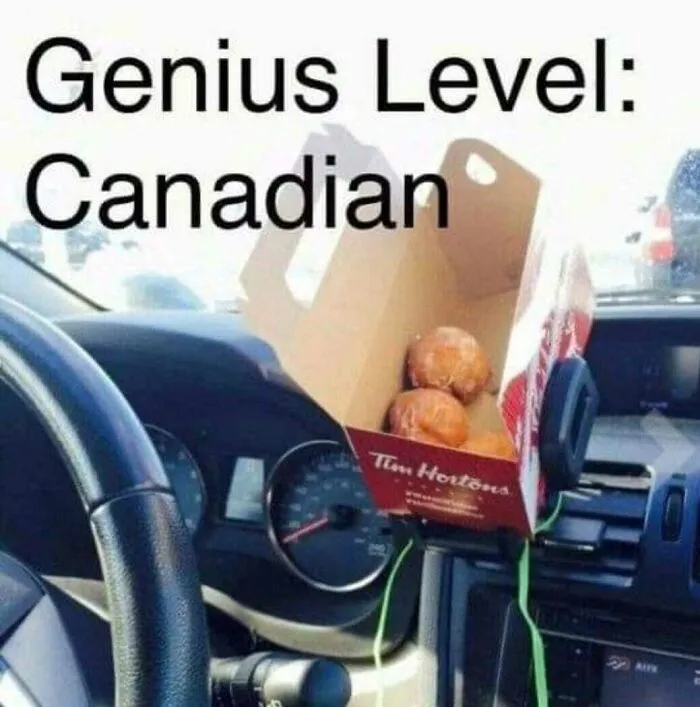 Car dashboard with a Tim Hortons box held by green strings, showcasing a funny Canadian meme about clever food hacks.