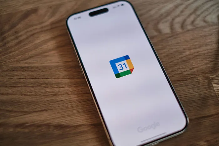 Smartphone displaying Google Calendar app, illustrating real-life cheat codes for better time management and productivity.