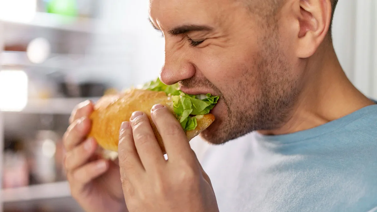 Heavy Eater Consumes 3+ Feet Of Sandwich, Angry Party Host Asks Him To Get Help